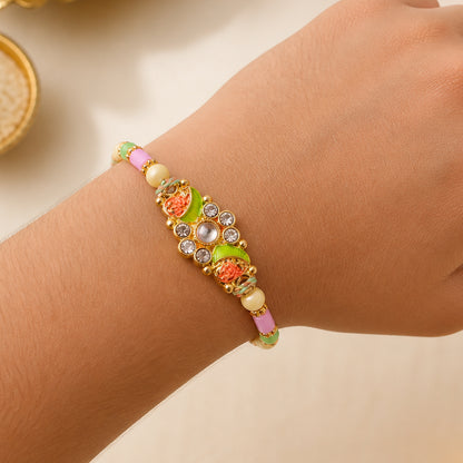 Ornate Rakhi featuring Floral Mirror Medallion, bead line and chain look for Gift Use