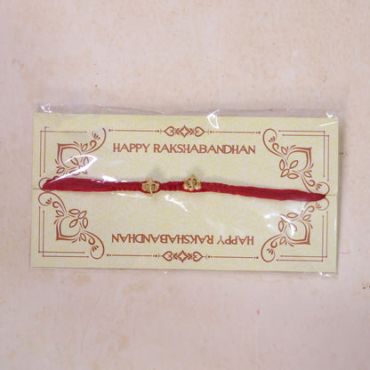 Red Thread Rakhi with Twin Antique Gold Ganesha Shaped Charms