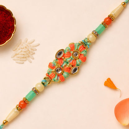 Marigold Style Floral Kundan Pendant Rakhi with Teal Beads
