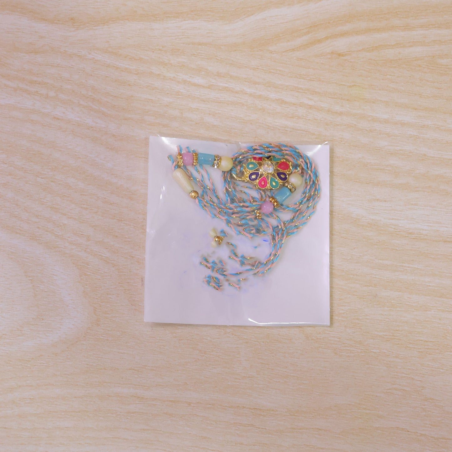 Multicolor Floral Kundan Pendant Rakhi with Pastel Beads