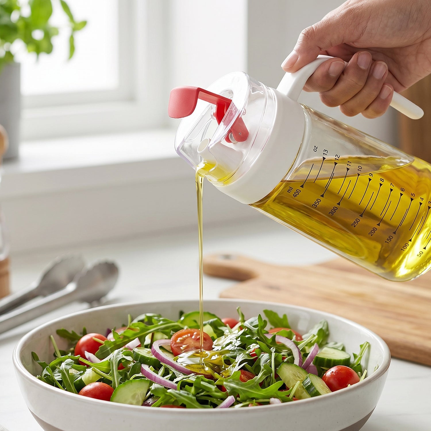 Hand Holding Glass Oil Bottle Drizzling Olive Oil onto Arugula Salad