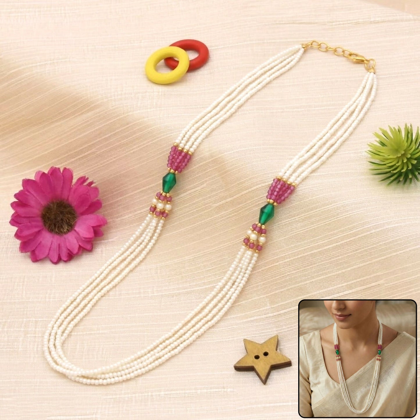 Multi-layer pearl necklace with pink and green accents front view