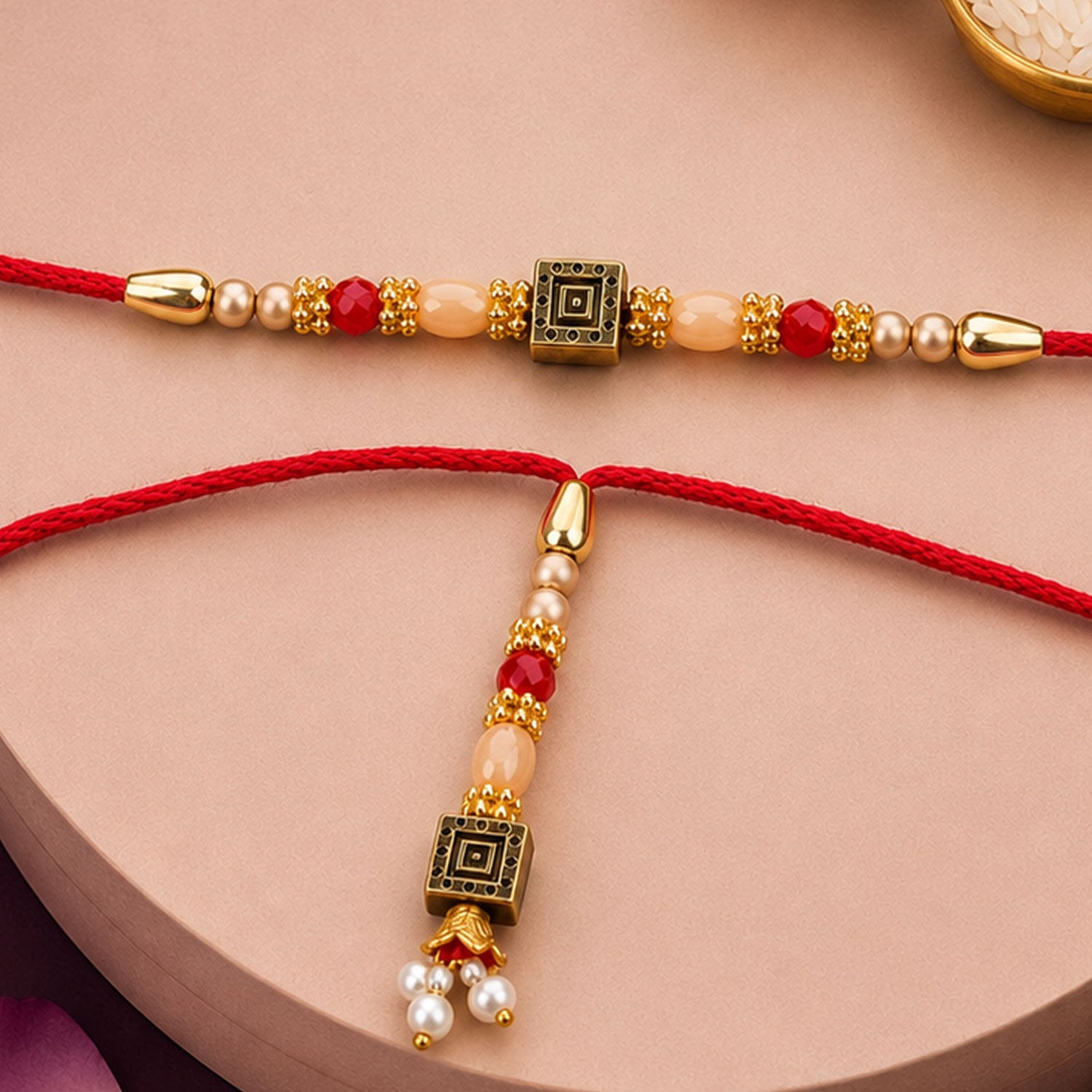 Graceful Circular Medallion Bhai Bhabhi Rakhi with Oval Pendant for Festive Gifting