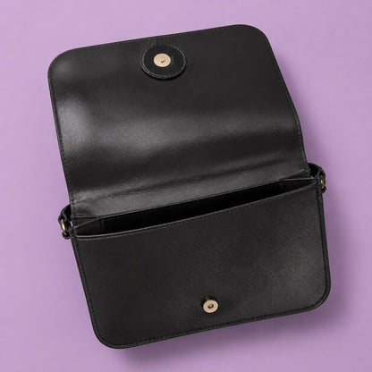 Open compartment of purple sling bag showing spacious interior