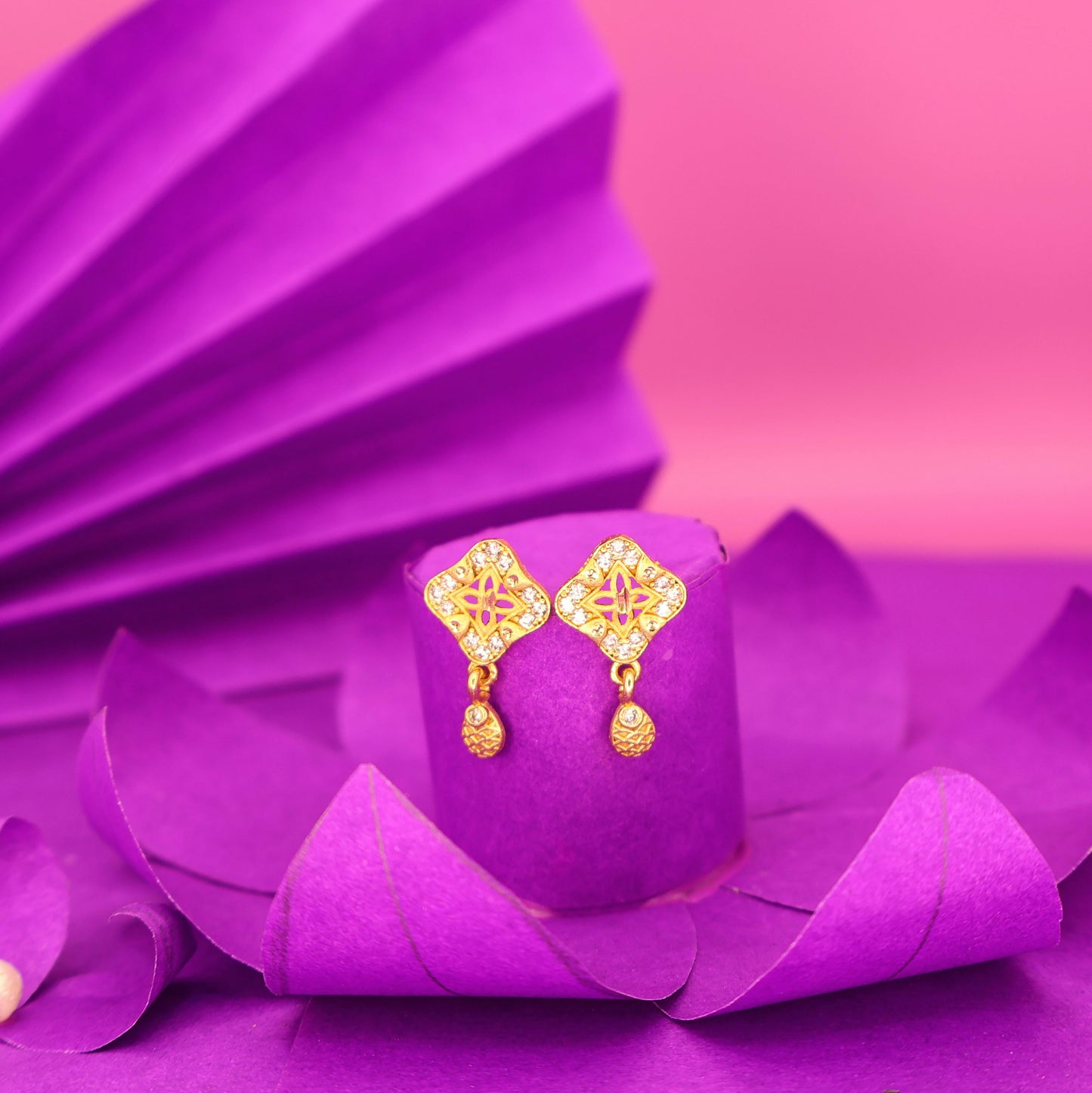 Gold plated square stud earrings with intricate traditional design and AD stones