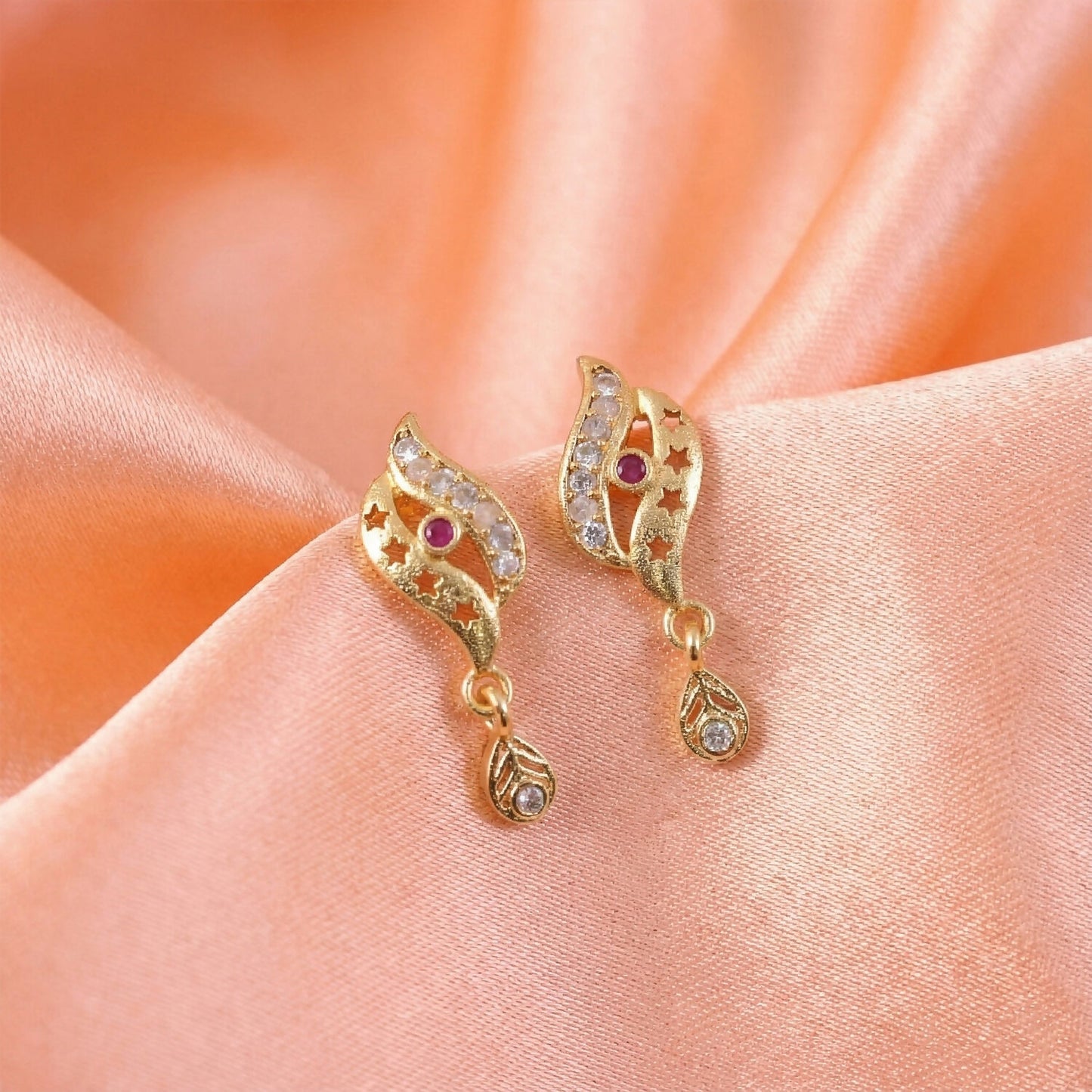 Star Cut Pattern Gold Finish Earrings With Crystal Detailing And Teardrop Charm