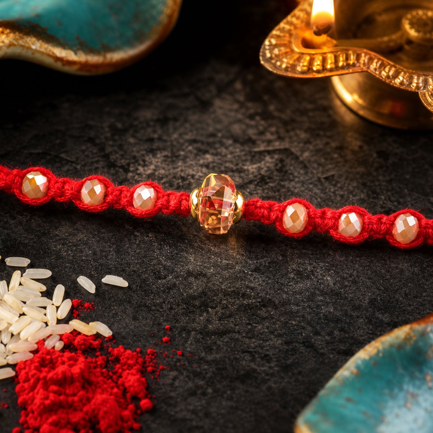 Red Beaded Rakhi with Champagne Crystal Bead and Red Bead Accents