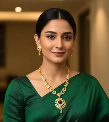 Gold plated pendant necklace and earrings set styled with traditional Indian attire