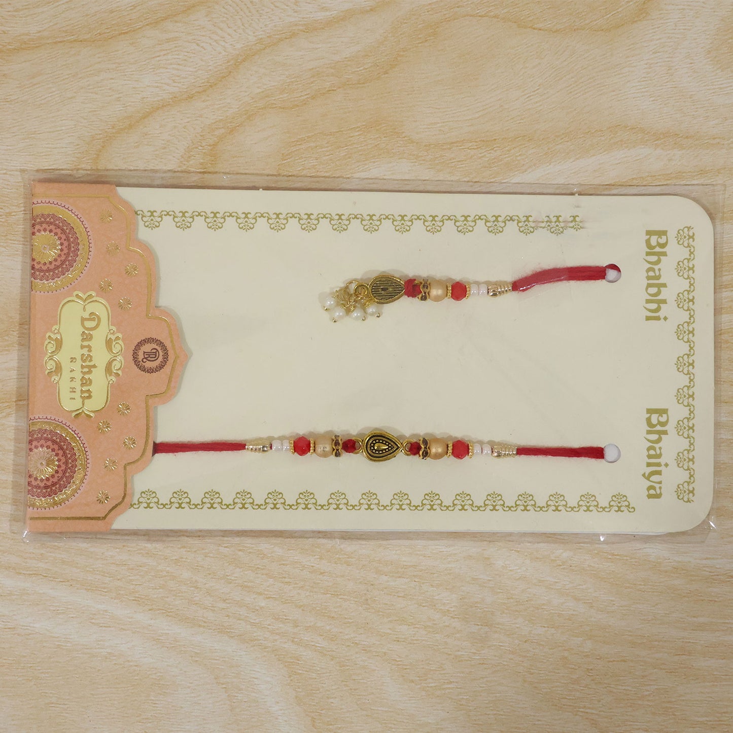 Graceful Teardrop Eye Bhai Bhabhi Rakhi with Drop Pendant and Pearl Tassel for Gift