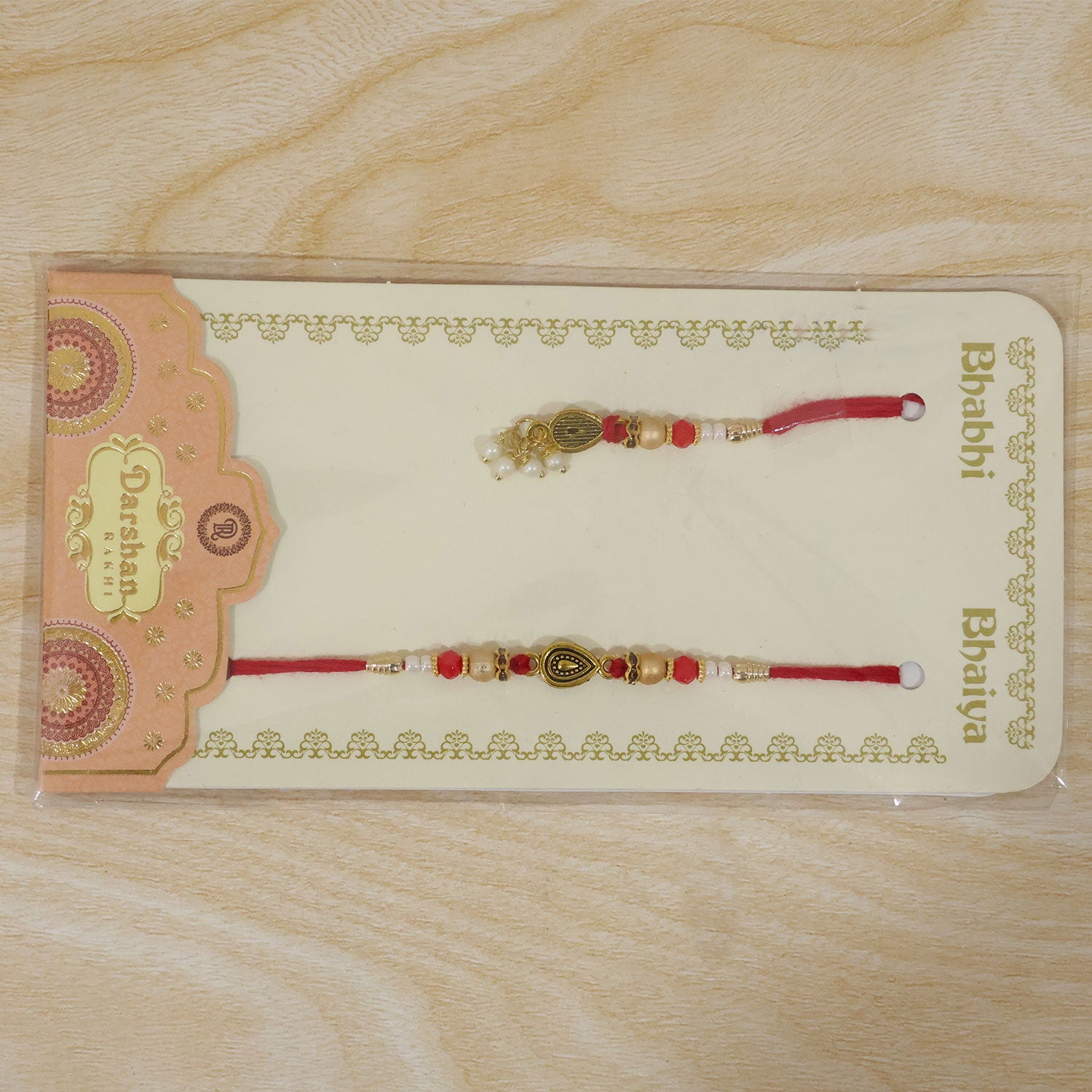Graceful Teardrop Eye Bhai Bhabhi Rakhi with Drop Pendant and Pearl Tassel for Gift