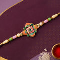 Graceful Rakhi with Square Floral Medallion and bead line in chain look for Gift Use