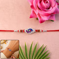 Blue Mor Enamel Rakhi with Silver Beads and Red Thread
