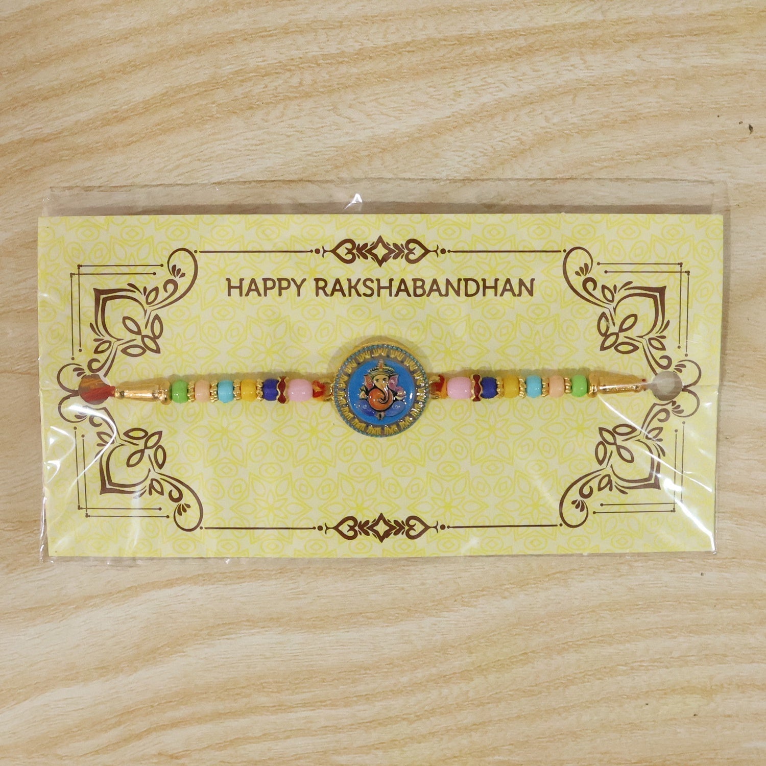 Shop Lord Ganesha Round Coin Designer Rakhi for Raksha Bandhan (10pcs)