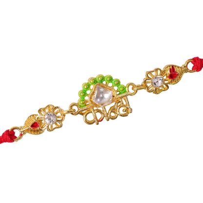Gold-Toned Kanha Rakhi with Kundan-Style Stone, Green Enamel, Crystal Accents & Red Thread