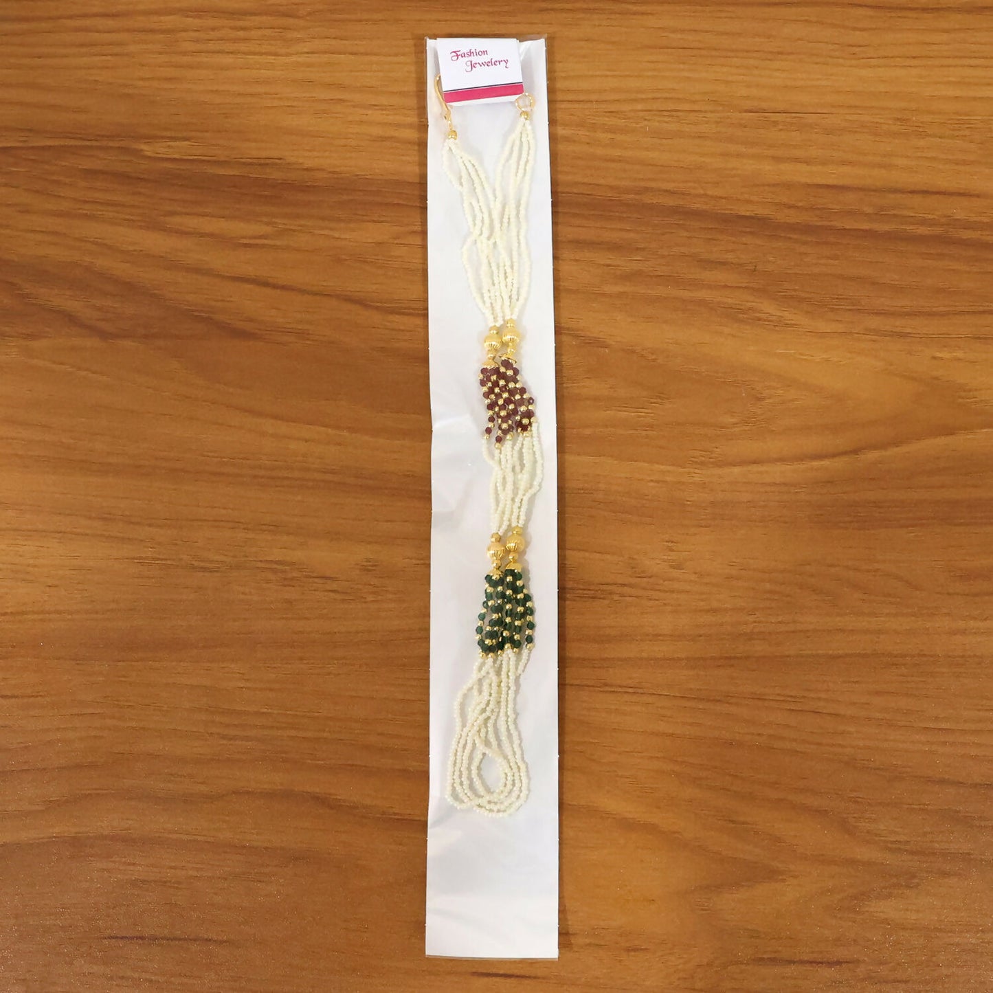 Festive traditional mala necklace with layered white beads and colorful accents