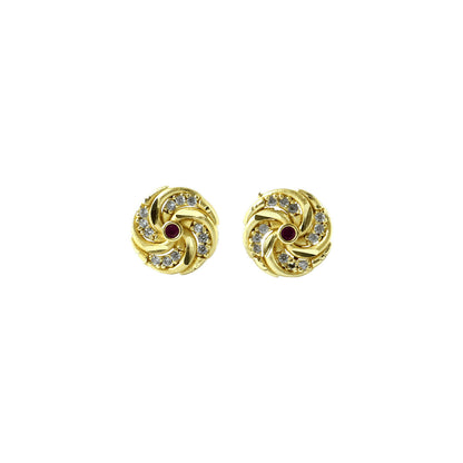 Fashionable gold earrings with intricate spiral design and red accents