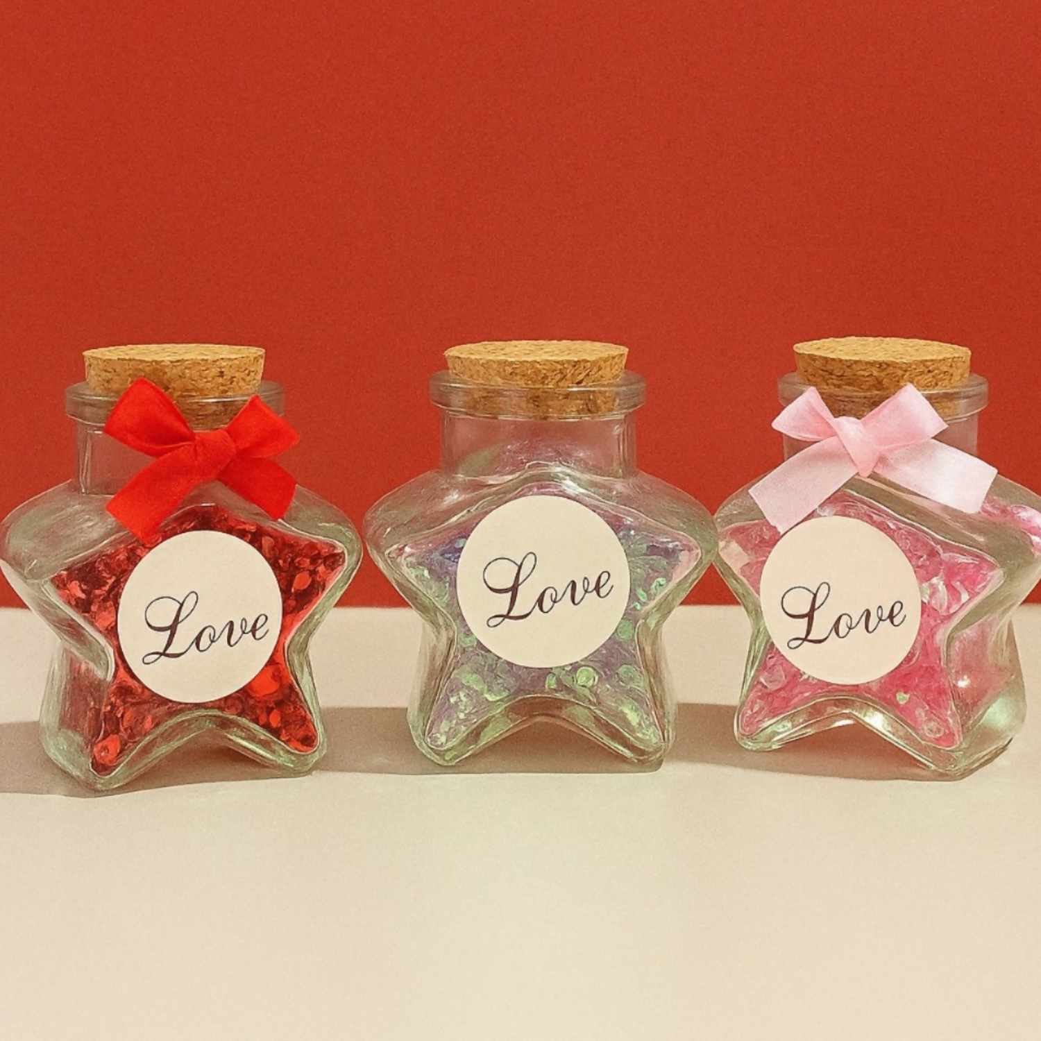 Star Shaped Glass Love Jar Bottles with Cork Lid and Decorative Ribbon – Set of 3 (Red, Blue & Pink) | Cute Romantic Gift Bottles for Valentine’s Day, Anniversary, Birthday, Home Decor | Glitter Filled Mini Message Bottles