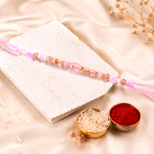 Soft pearl beaded rakhi with delicate colours and bracelet style finish.