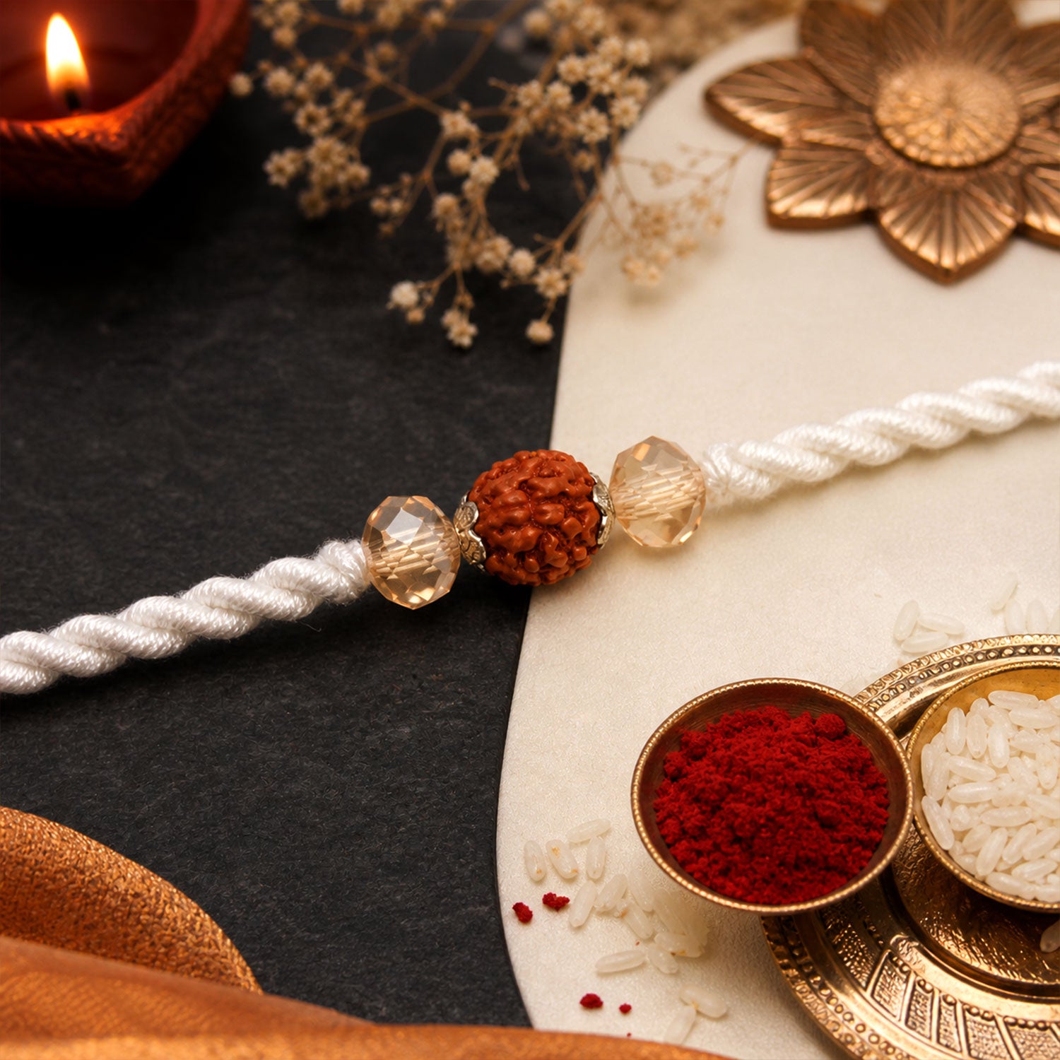 White Thread Rakhi with Rudraksha Bead and Sparkling Crystal Accents