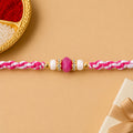 Pink-White Braided Rakhi with Rose-Pink Stone Bead Pendant