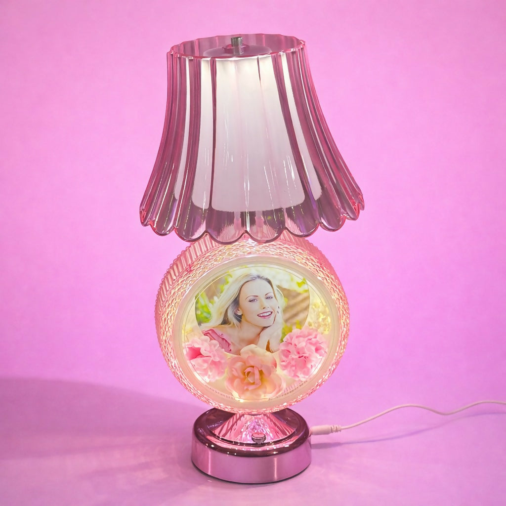 Illuminated round photo table lamp showing soft warm glow