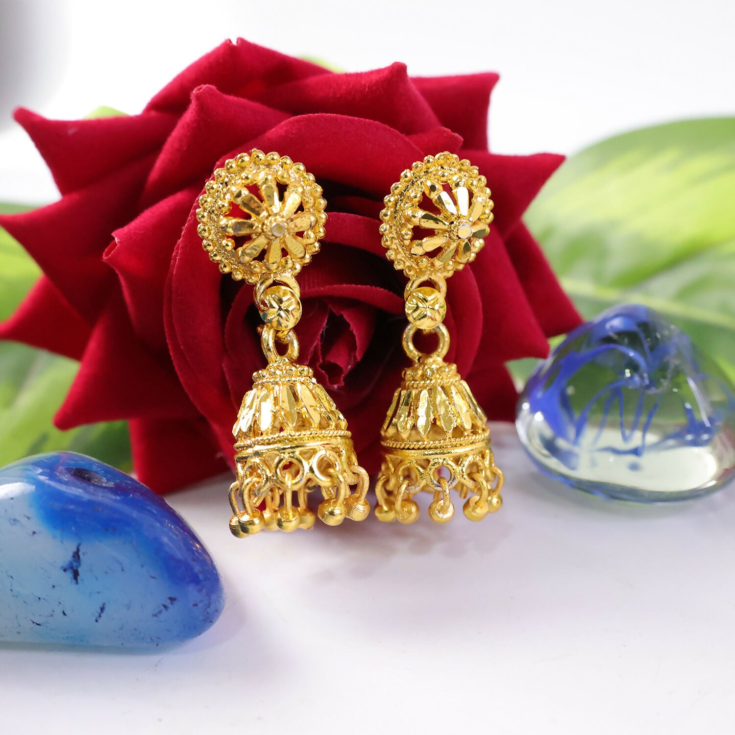 Ethnic outfit styled with gold plated floral jhumka earrings