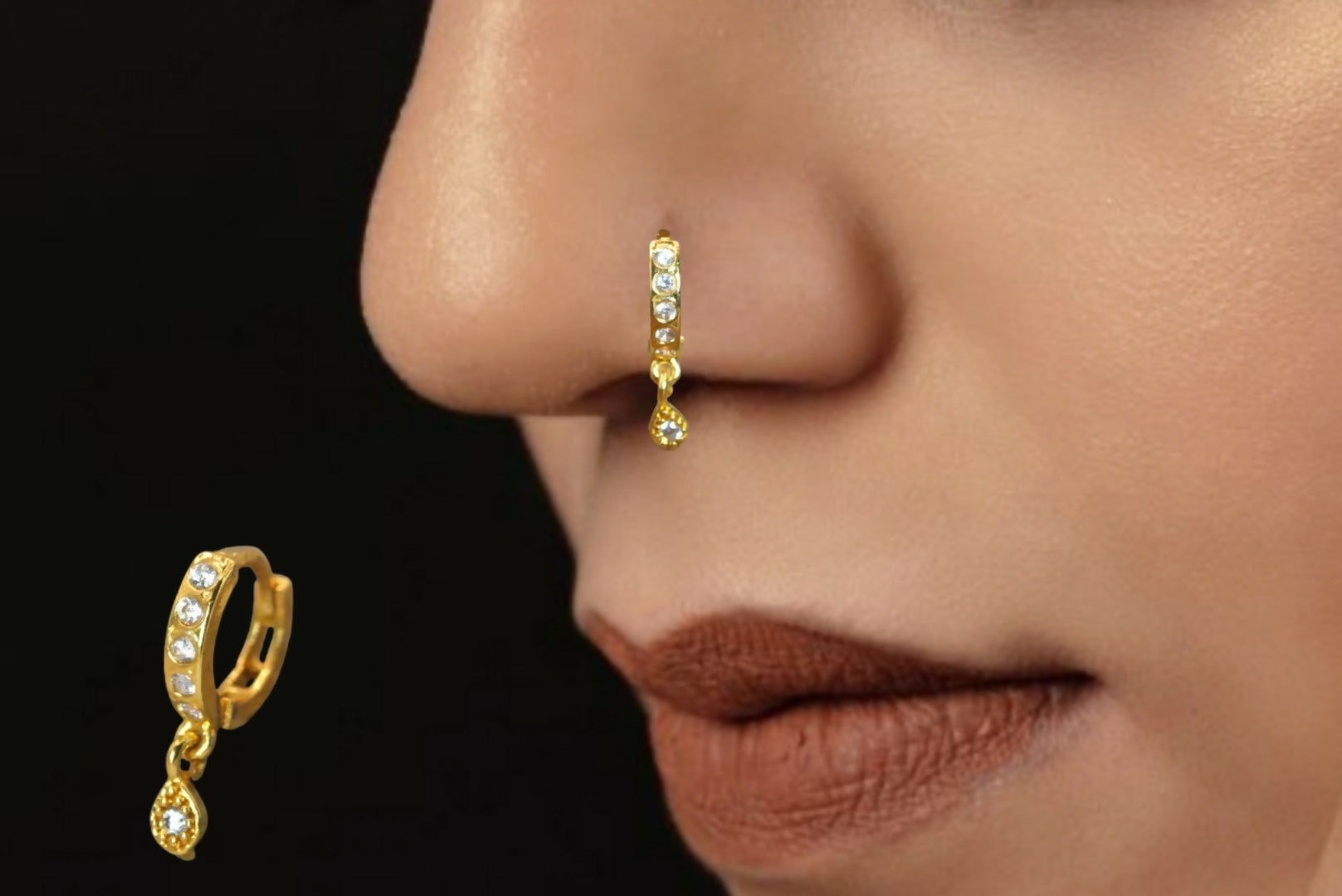 Close-up of gold plated teardrop dangle on huggie earrings for women and girls