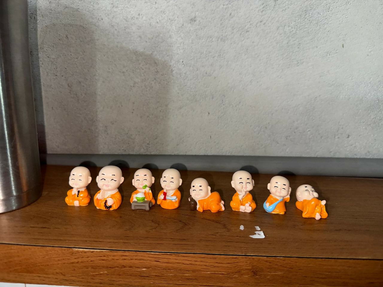 Smiling Monk Showpiece Set of 8 | Mini Buddha Figurines for Home Decor