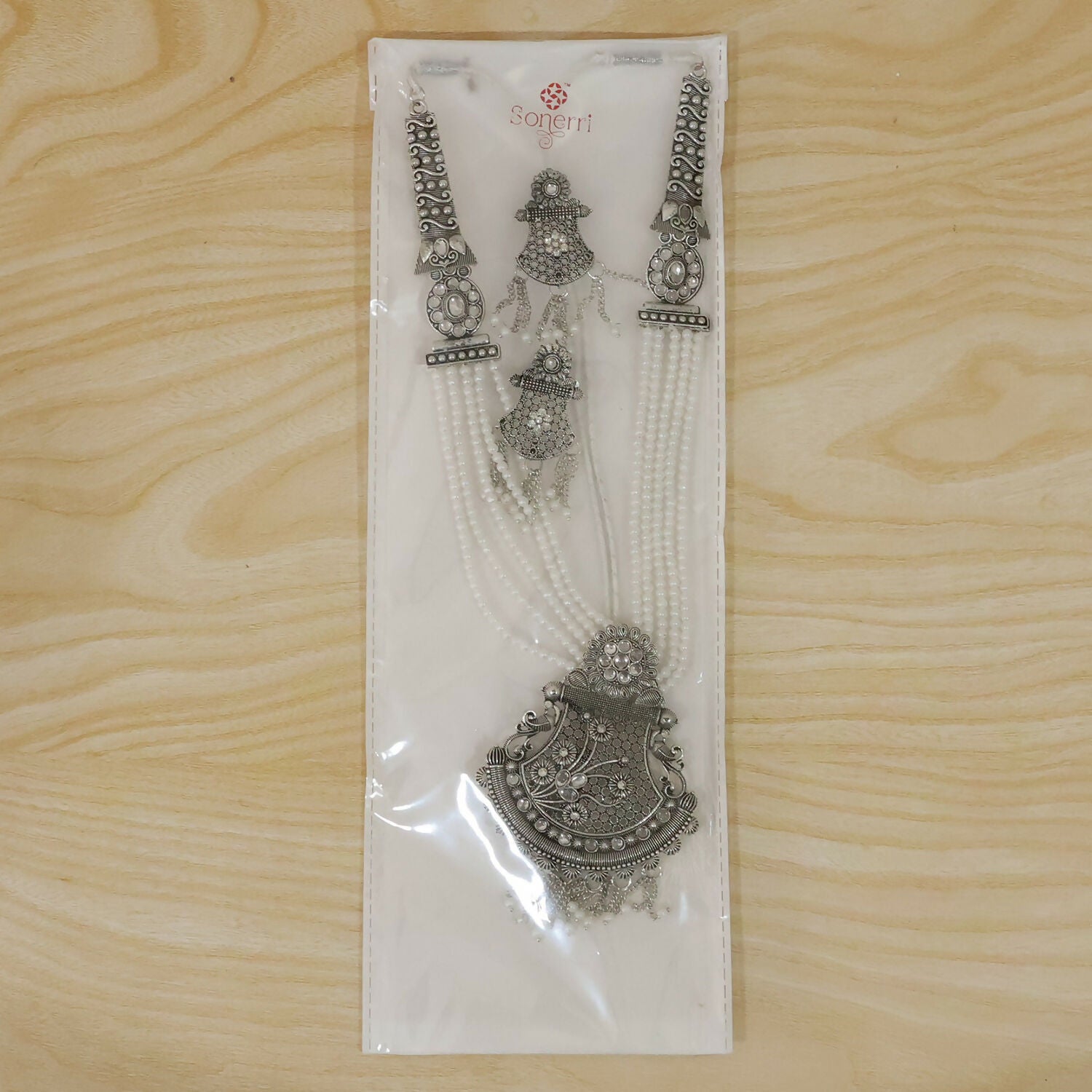 Detailed craftsmanship of silver necklace pendant