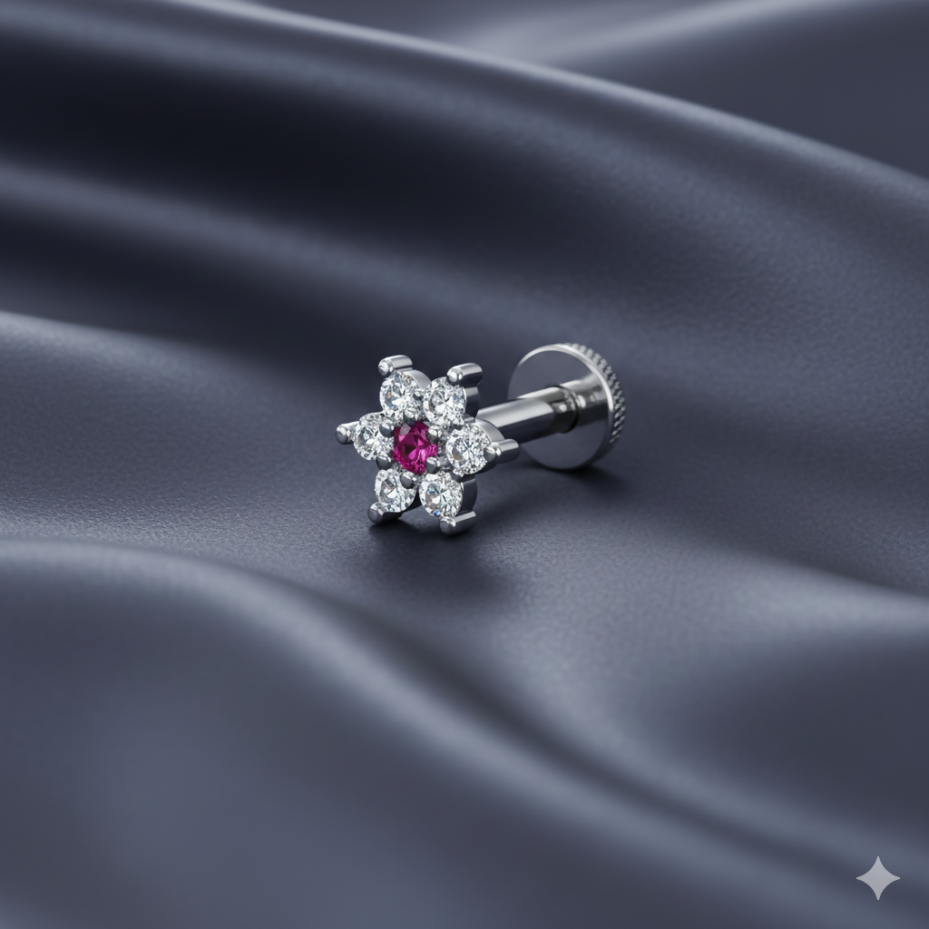 Close-up image of silver-plated ruby floral stud earring displaying detailed floral design