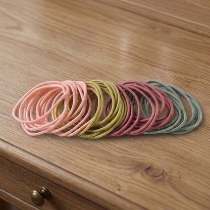 Collection of elastic hair bands in neutral shades
