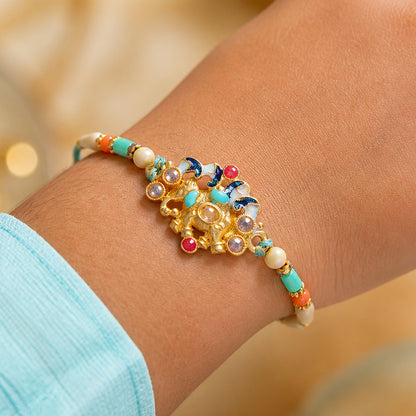 Festive Rakhi featuring Ornate Floral Charm and bead line in gift style for Gift Use