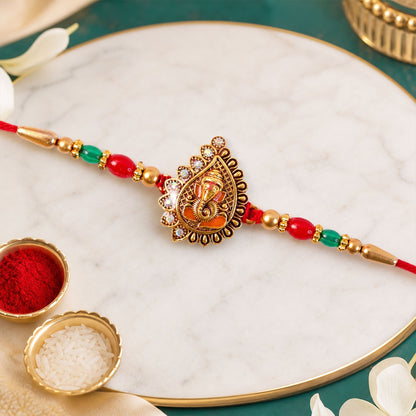 Antique Golden Ganesha Rakhi with Red & Green Beads and Crystals (5pcs)