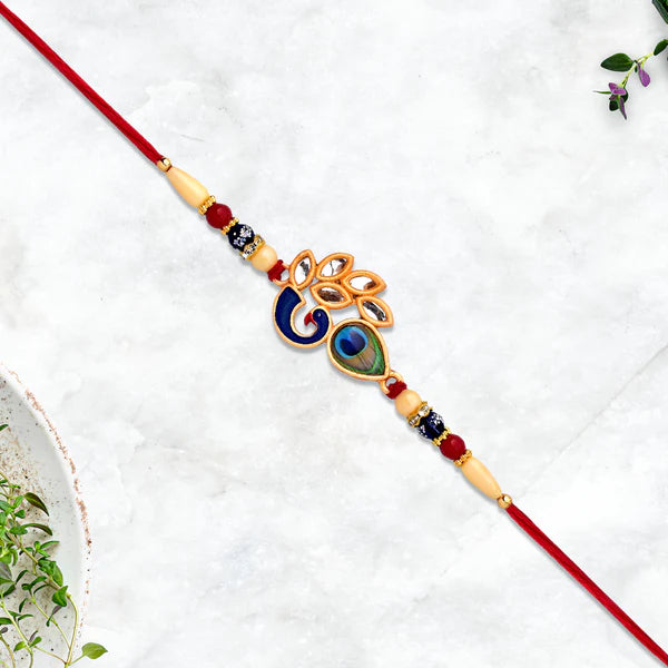 Artisan handcrafted Mor Pankh Rakhi showing its unique traditional thread.