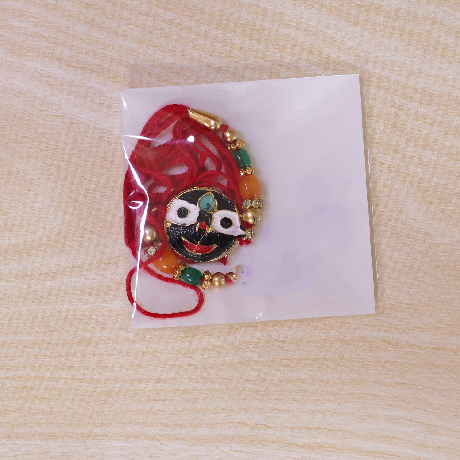 Lord Jagannath Enamel Pendant Rakhi with Multicolor Beads