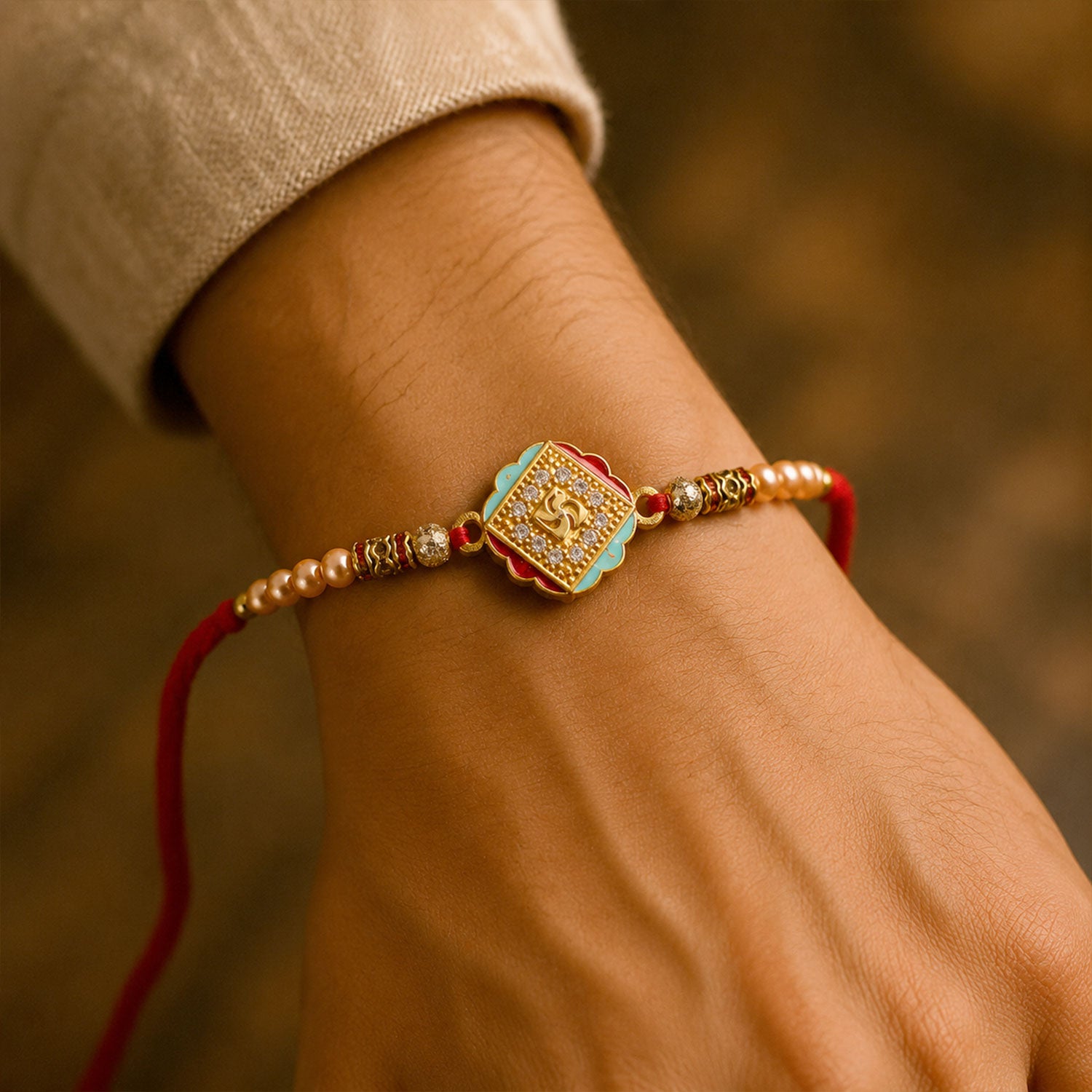 Silver Rakhi with Golden Square Om Centre, Roli Chawal Coin and Peacock Gift Packing