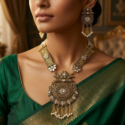 Close-up of gold pendant and pearl details