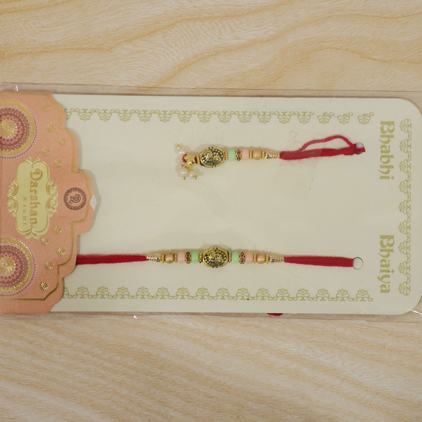 Divine Circular Medallion Bhai Bhabhi Rakhi with Oval Charm and Bead Accents for Gift
