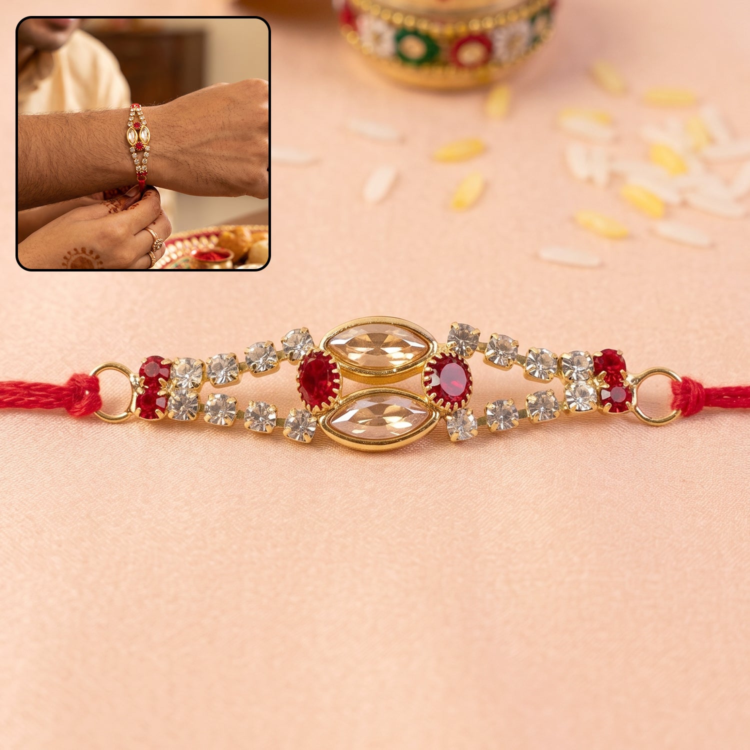 Oval Kundan Bracelet Rakhi with Red Blue Stones and Crystal Line