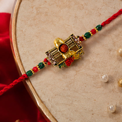 Traditional Shivling Rudraksha Rakhi with Red & Green Beads