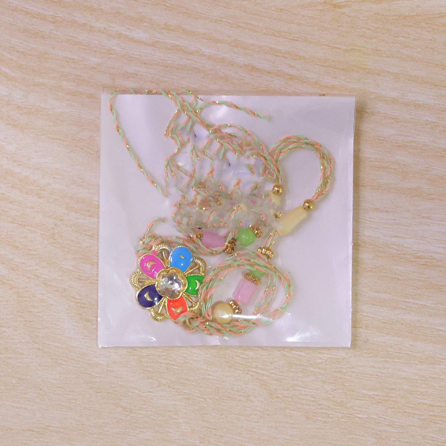 Multicolor Floral Kundan Pendant Rakhi with Pastel Beads