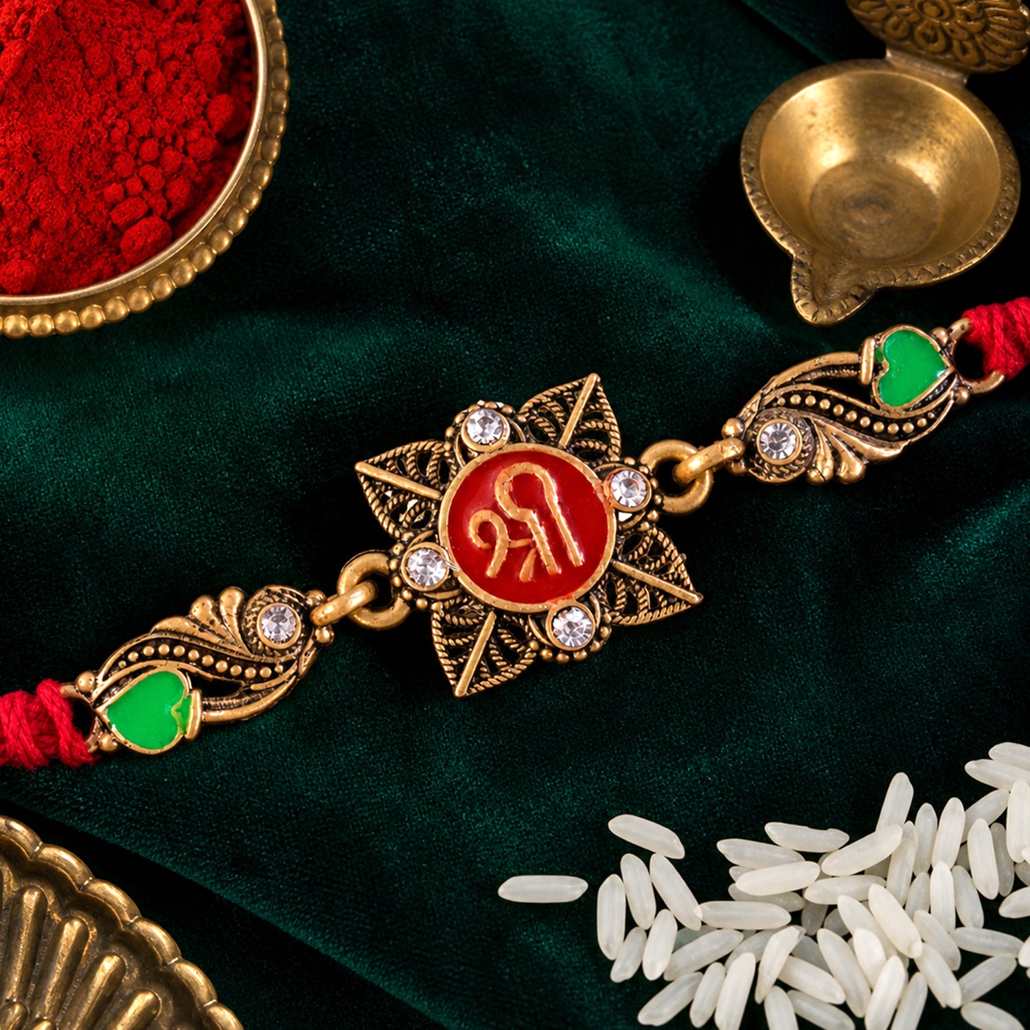 Antique Gold-Toned Shree Rakhi with Crystal Accents, Green Enamel & Designer Red Thread