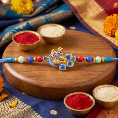 Rakhi – Elegant twin peacock designer festival ornament