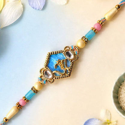Om Hexagon Pendant Rakhi with Blue Enamel and Kundan Stones