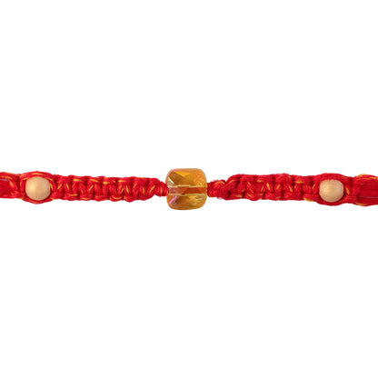 Red Thread Rakhi with a Faceted Amber-Toned Crystal Cube Bead