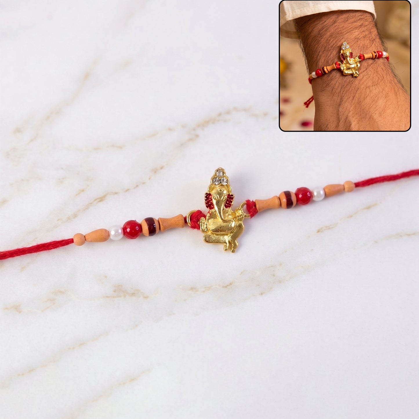 Golden Ganesha Rakhi with Peach Beads and Pearl Accents