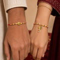 Couple Rakhi with Gold Coin Charm, Pearl Drop and Multicolor Bead Accents