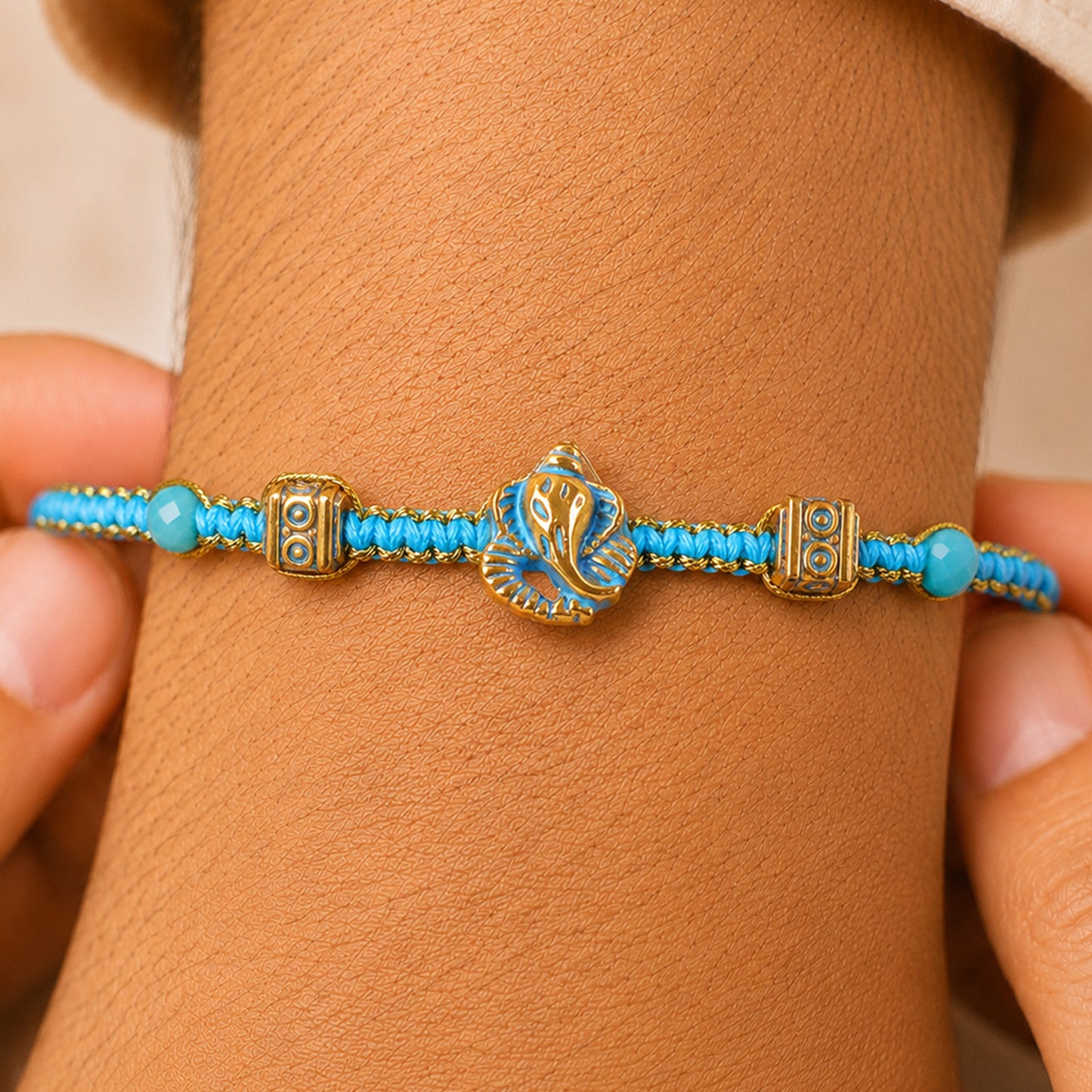 Turquoise Center Designer Rakhi with Gold Tone Detail and Elegant Bracelet Beauty