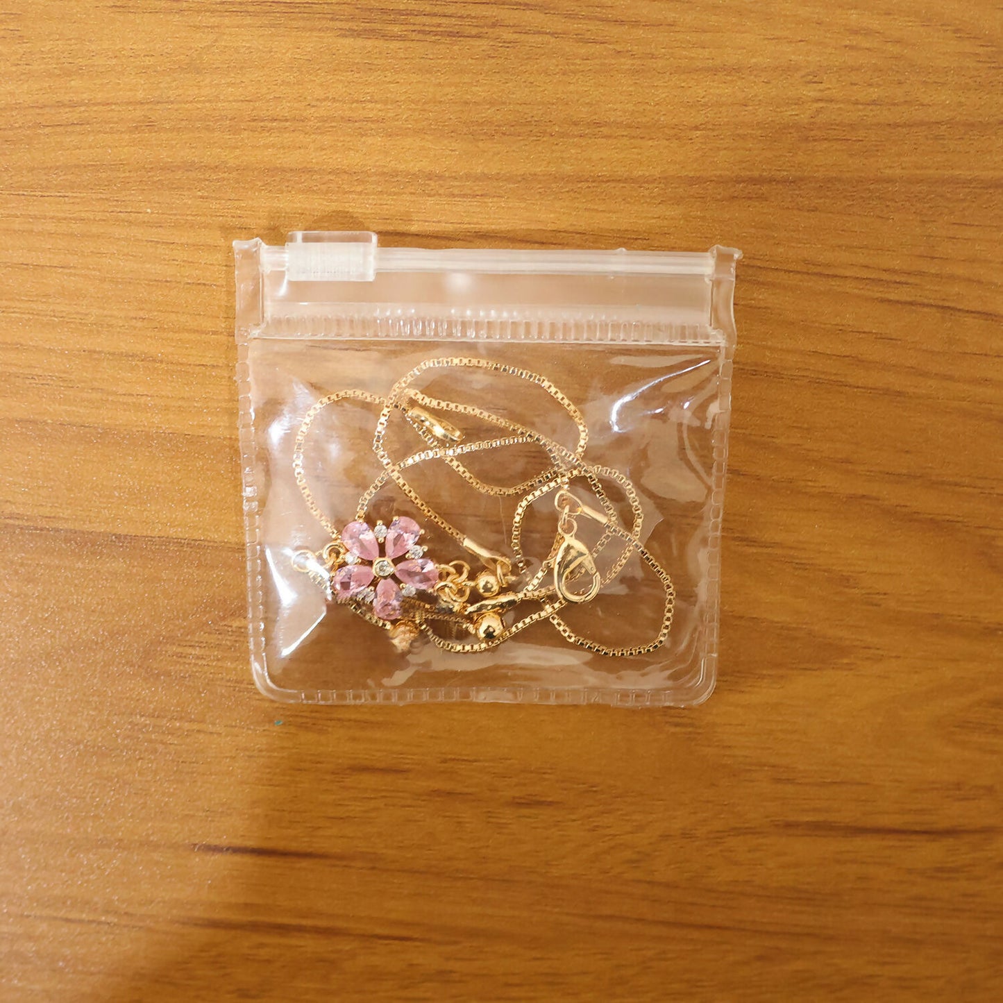 Beautiful pink floral pendant necklace with gold chain, perfect for gifting