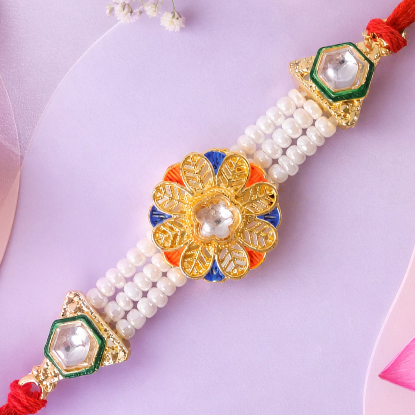 Pearl Flower Rakhi with Blue Yellow Details and Elegant Festive Brother Gift Styling